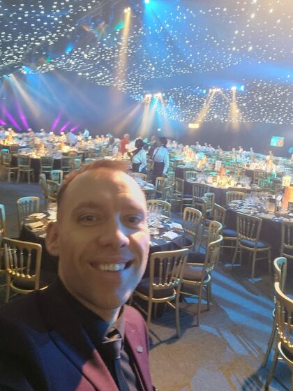 A ballroom under a ceiling of star lights before guests arrive