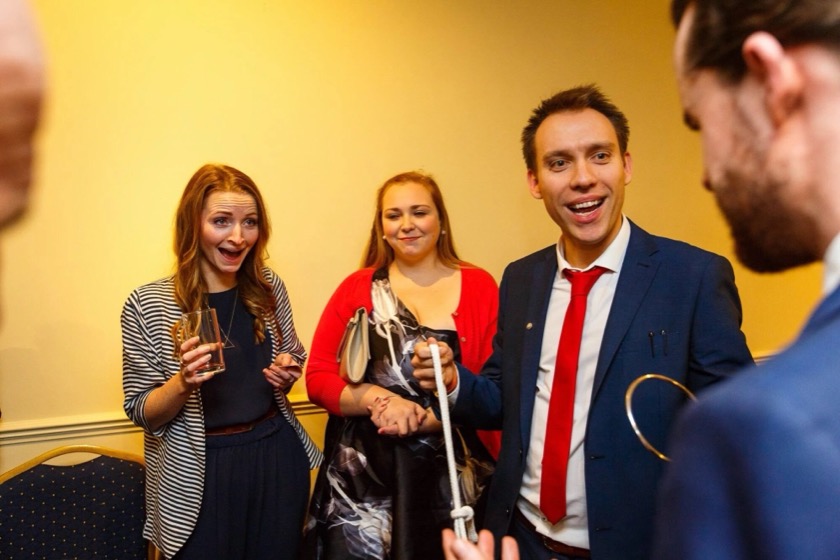 Two wedding guests open-mouthed as Neil finishes a routine
